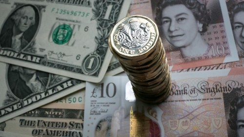 BATH, ENGLAND - OCTOBER 13: In this photo illustration, a stack of £1 coins is seen with the new £10 note alongside US dollar bills on October 13, 2017 in Bath, England. Currency experts have warned that as the uncertainty surrounding Brexit continues, the value of the British pound, which has remained depressed against the US dollar and the euro since the UK voted to leave in the EU referendum, is likely to fluctuate. (Photo Illustration by Matt Cardy/Getty Images)