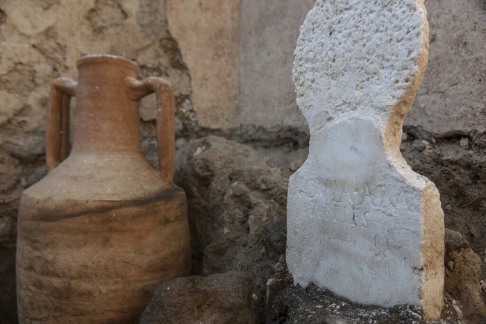 Italy Pompeii Discovery In this undated photo released by the Pompeii archeological park, a urn found in the necropolis of Porta Sarno, in an area not yet open to the public in the east of Pompeiiβs urban center. Archaeologists in the ancient city of Pompeii have discovered a remarkably well-preserved skeleton during excavations that also shed light on the cultural life of the city before it was destroyed by a volcanic eruption in AD 79. The discovery is unusual since most adults were cremated at the time. (Alfio Giannotti/Pompeii Archeological Park via AP)