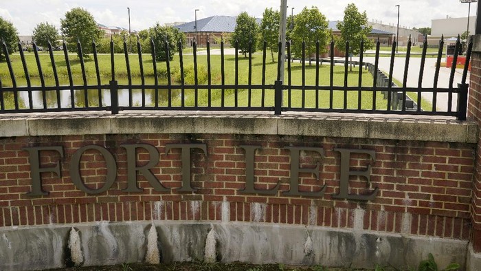 A sign marks one of the entrances of the U.S. Army base Fort Lee Tuesday, Aug. 17, 2021, in Petersburg, Va. Afghan refugees who have been prescreened by the U.S. Department of Homeland Security have been taken to Fort Lee and other temporary reception centers are being set up at Fort Bliss in Texas and Fort McCoy in western Wisconsin. (AP Photo/Steve Helber)