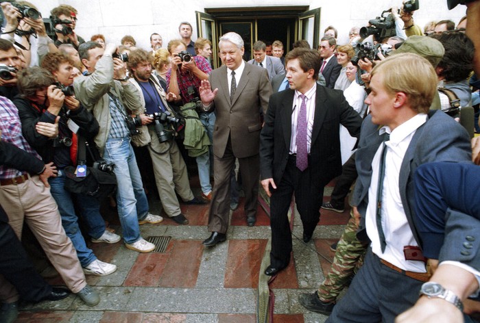 Russia Chronicling Soviet Coup FILE - In this Friday, Aug. 23, 1991 file photo, people kick the head of the statue of Felix Dzerzhinsky, the founder of the Soviet secret police, in front of the KGB main headquarters on the Lubyanka Square in Moscow, Russia. The statue was pulled down after the defeat of the August 1991 hardline coup. I was out on the streets, shooting exultant crowds across the city and managed to catch the moment when demonstrators pulled down the statue of Felix Dzerzhinsky, the founder of the Soviet secret police, in front of the KGB main headquarters on the Lubyanka Square - a watershed moment that symbolized the collapse of the repressive Soviet system.(AP Photo/Alexander Zemlianichenko, File)