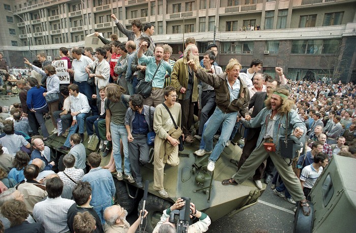 Russia Chronicling Soviet Coup FILE - In this Friday, Aug. 23, 1991 file photo, people kick the head of the statue of Felix Dzerzhinsky, the founder of the Soviet secret police, in front of the KGB main headquarters on the Lubyanka Square in Moscow, Russia. The statue was pulled down after the defeat of the August 1991 hardline coup. I was out on the streets, shooting exultant crowds across the city and managed to catch the moment when demonstrators pulled down the statue of Felix Dzerzhinsky, the founder of the Soviet secret police, in front of the KGB main headquarters on the Lubyanka Square - a watershed moment that symbolized the collapse of the repressive Soviet system.(AP Photo/Alexander Zemlianichenko, File)