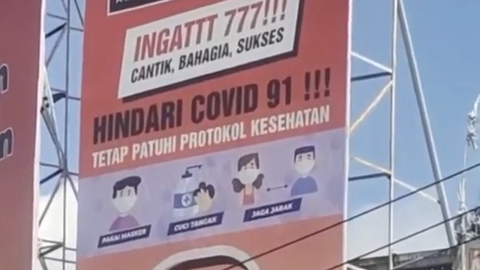 Viral Baliho Salah Tulis Hindari COVID 91!!! di Tabanan Bali (Foto: Tangkapan layar video viral)