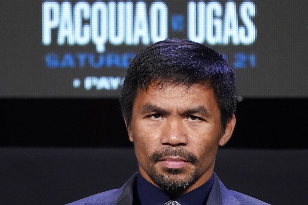 Manny Pacquiao, of the Philippines, attends a news conference Wednesday, Aug. 18, 2021, in Las Vegas. Pacquiao is scheduled to fight Yordenis Ugas, of Cuba, in a welterweight championship bout Saturday in Las Vegas. (AP Photo/John Locher)