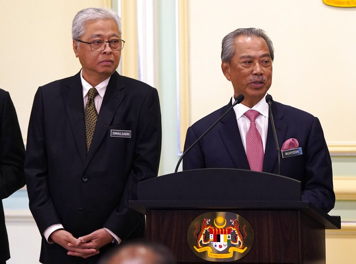 KUALA LUMPUR, MALAYSIA - MARCH 01: Muhyiddin Yassin, Malaysia's newly appointed Prime Minister waves to the media outside his house with his family and supporters before departing for the swearing in ceremony at the palace on March 1, 2020 in Kuala Lumpur, Malaysia. (Photo by Ore Huiying/Getty Images)