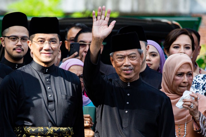 KUALA LUMPUR, MALAYSIA - MARCH 01: Muhyiddin Yassin, Malaysia's newly appointed Prime Minister waves to the media outside his house with his family and supporters before departing for the swearing in ceremony at the palace on March 1, 2020 in Kuala Lumpur, Malaysia. (Photo by Ore Huiying/Getty Images)