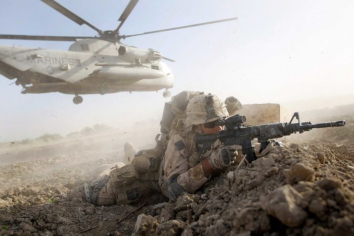 402462 11: United States and Canadian Army medics render first aid to an American soldier, who fainted due to altitude sickness, during search and destroy operations against Taliban and al-Qaida fighters March 15, 2002 in the rugged Shah-e-Kot mountains, 25 kilometers (15 miles) southeast of Gardez, Afghanistan. Hundreds of American and Canadian troops were lifted into the mountainous region at high altitude to search for and destroy any enemy they encounter. (Pool Photo/Getty Images)