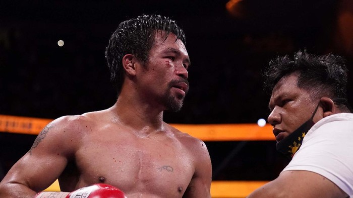 Momen Manny Pacquiao Dikalahkan Yordenis Ugas Yordenis Ugas, of Cuba, celebrates his unanimous decision win over Manny Pacquiao, of the Philippines, in a welterweight championship boxing match Saturday, Aug. 21, 2021, in Las Vegas. (AP Photo/John Locher)