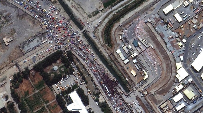 This satellite image provided by Maxar Technologies shows crowds and traffic at the northern gate of Kabul’s international airport on Monday, Aug. 23, 2021. (Satellite Image ©2021 Maxar Technologies via AP)