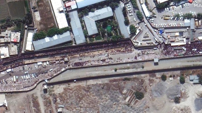 This satellite image provided by Maxar Technologies shows crowds and traffic at the northern gate of Kabul’s international airport on Monday, Aug. 23, 2021. (Satellite Image ©2021 Maxar Technologies via AP)
