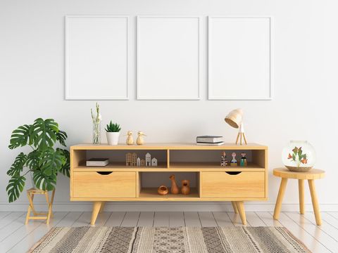 Three blank photo frame for mockup and sideboard in living room, 3D rendering