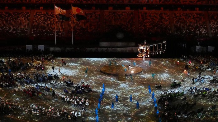 Entertainers perform during the opening ceremony for the 2020 Paralympics at the National Stadium in Tokyo, Tuesday, Aug. 24, 2021. (AP Photo/Eugene Hoshiko)