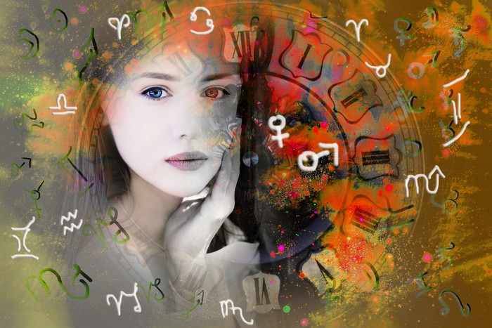 Female face, space and zodiac signs and planets symbols.