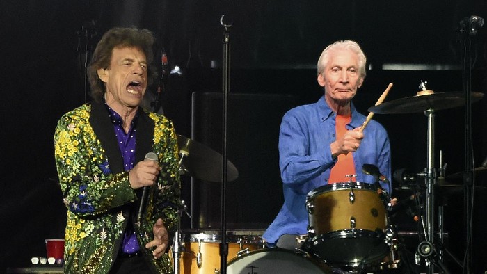 FILE - Rolling Stones drummer Charlie Watts, right, performs behind singer Mick Jagger during their concert at the Rose Bowl, Thursday, Aug. 22, 2019, in Pasadena, Calif. Watts died in London today at age 80. (AP Photo/Chris Pizzello, File)