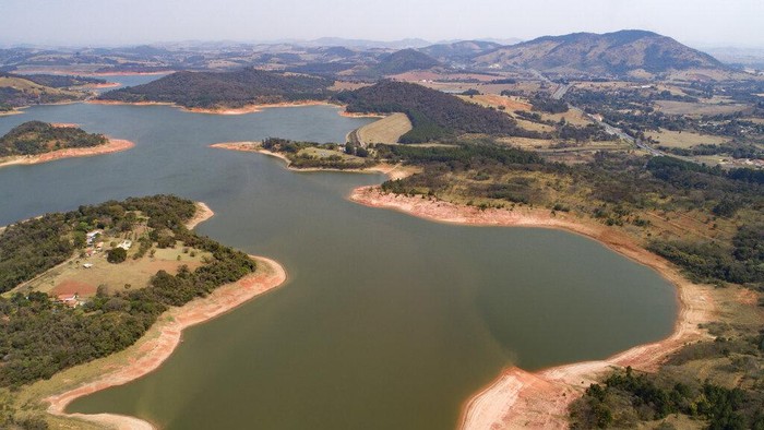 A capybara jumps into the Jaguari dam, which is part of the Cantareira System, responsible for providing water to the Sao Paulo metropolitan area, in Braganca Paulista, Brazil, Wednesday, Aug. 25, 2021. Water levels plunged during the drought season, bringing concerns about the water supply to the largest Brazilian metropolitan area. (AP Photo/Andre Penner)
