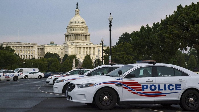 Washington Metropolitan Police vehicles hold on the perimeter of the Capitol in Washington, Thursday evening, Aug. 26, 2021.  (AP Photo/J. Scott Applewhite)