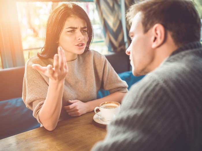 1083082610 The man and woman quarreling in the cafe