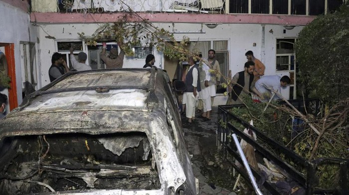 Afghan people are seen inside a house after U.S. drone strike in Kabul, Afghanistan, Sunday, Aug. 29, 2021. A U.S. drone strike destroyed a vehicle carrying 