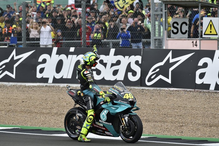 Italian rider Valentino Rossi of the Petronas Yamaha SRT waves to fans after the MotoGP race at the British Motorcycle Grand Prix at the Silverstone racetrack, in Silverstone, England, Sunday, Aug. 29, 2021. (AP Photo/Rui Vieira)