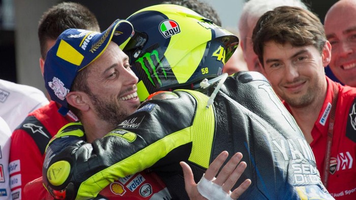RIO HONDO, ARGENTINA - MARCH 31: Valentino Rossi of Italy and Yamaha Factory Racing  celebrates withAndrea Dovizioso of Italy and Ducati Team (R) under the podium at the end of the MotoGP race  during the MotoGp of Argentina - Race on March 31, 2019 in Rio Hondo, Argentina. (Photo by Mirco Lazzari gp/Getty Images)