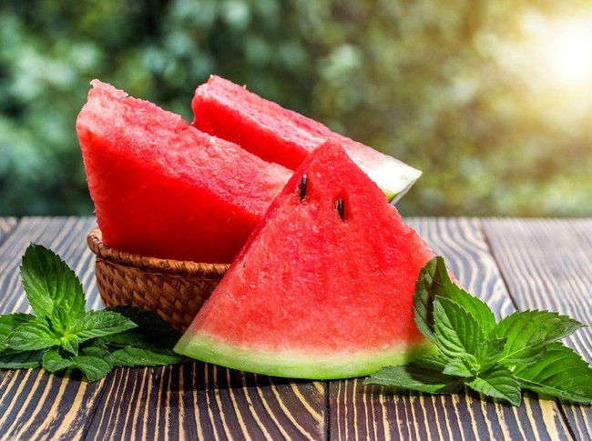 Buah Semangka Fresh sliced watermelon wooden old background