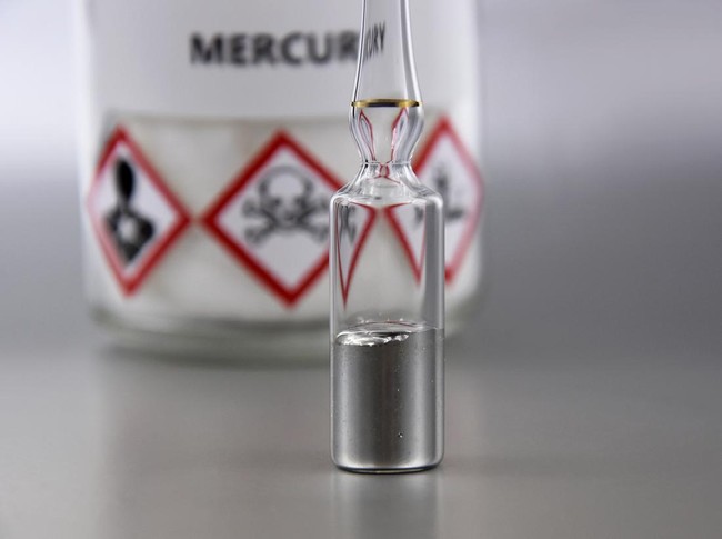 Laboratory accessories images. Mercury in a sealed ampoule stock photo. Laboratory equipment on a silver background. Hg, toxic chemical element stock images