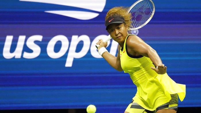 Naomi Osaka, of Japan, returns a shot to Marie Bouzkova, of the Czech Republic, during the first round of the US Open tennis championships, Monday, Aug. 30, 2021, in New York. (AP Photo/Elise Amendola)