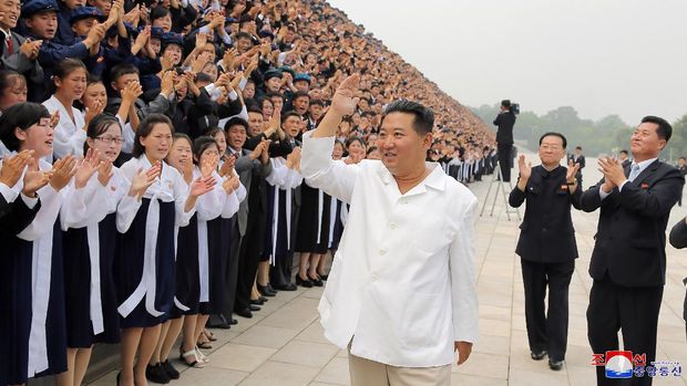 In this undated photo provided by the North Korean government on Tuesday, Aug. 31, 2021, North Korean leader Kim Jong Un, center, meets the participants in Youth Day celebrations during a photo session at an undisclosed place in North Korea. Independent journalists were not given access to cover the event depicted in this image distributed by the North Korean government. The content of this image is as provided and cannot be independently verified. Korean language watermark on image as provided by source reads: 