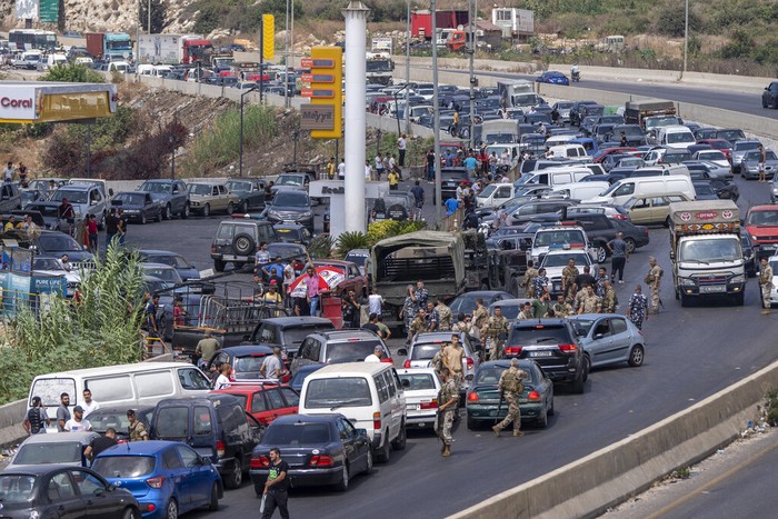 Krisis BBM di Lebanon A general view of a petrol station on the main highway that links the Capital Beirut to south Lebanon, as cars come from every direction to try and fill their tanks with gasoline, in the coastal town of Jiyeh, south of Beirut, Lebanon, Friday, Sept. 3, 2021. Lebanon is mired in a devastating economic and financial crisis, the worst in its modern history. A result of this has been crippling power cuts and severe shortages in gasoline and diesel that have been blamed on smuggling, hoarding and the cash-strapped government’s inability to secure deliveries of oil products. (AP Photo/ Hassan Ammar)