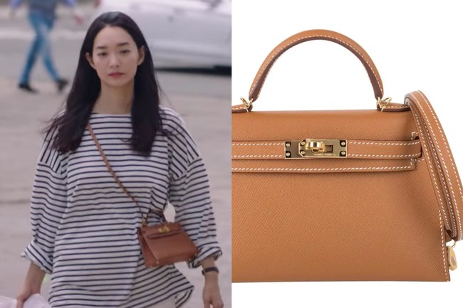 Dalam episode dua, Shin Min Ah mengenakan ’Sellier Mini Kelly II Bag’ keluaran Hermes. Pemeran dokter gigi itu mengenakan tas bernilai fantastis seharga 32,500 dollar atau sekitar Rp 463,1 juta. Foto: dok. Netflix, dok. Hermes