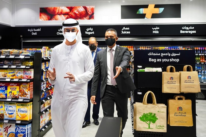Emirates High-Tech Supermarket A man uses a QR code on a mobile phone to enter Carrefour's new cashier-less grocery store in Mall of the Emirates in Dubai, United Arab Emirates, Monday, Sept. 6, 2021. The Middle East on Monday got its first completely automated cashier-less store, as retail giant Carrefour rolled out its vision for the future of the industry in a cavernous Dubai mall. (AP Photo/Isabel DeBre)