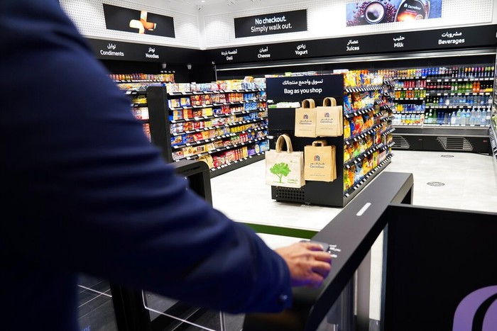 Emirates High-Tech Supermarket A man uses a QR code on a mobile phone to enter Carrefour's new cashier-less grocery store in Mall of the Emirates in Dubai, United Arab Emirates, Monday, Sept. 6, 2021. The Middle East on Monday got its first completely automated cashier-less store, as retail giant Carrefour rolled out its vision for the future of the industry in a cavernous Dubai mall. (AP Photo/Isabel DeBre)