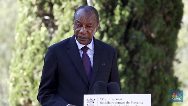FILE - In this Thursday, Aug. 15, 2019 file photo, Guinean President Alpha Conde delivers a speech during a ceremony marking the 75th anniversary of the WWII Allied landings in Provence, in Saint-Raphael, southern France. Witnesses say heavy gunfire has erupted near the presidential palace in Guinea's capital and went on for hours. It was not immediately known whether President Alpha Conde was home at the time the shooting began. But the gunfire prompted security concerns in the West African country with a long history of coup attempts.  (Eric Gaillard/Pool Photo via AP, File)