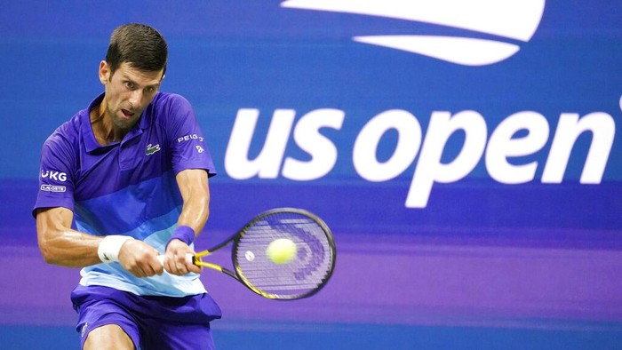 Novak Djokovic, of Serbia, returns against Jenson Brooksby, of the United States, during the fourth round of the US Open tennis championships, Monday, Sept. 6, 2021, in New York. (AP Photo/John Minchillo)