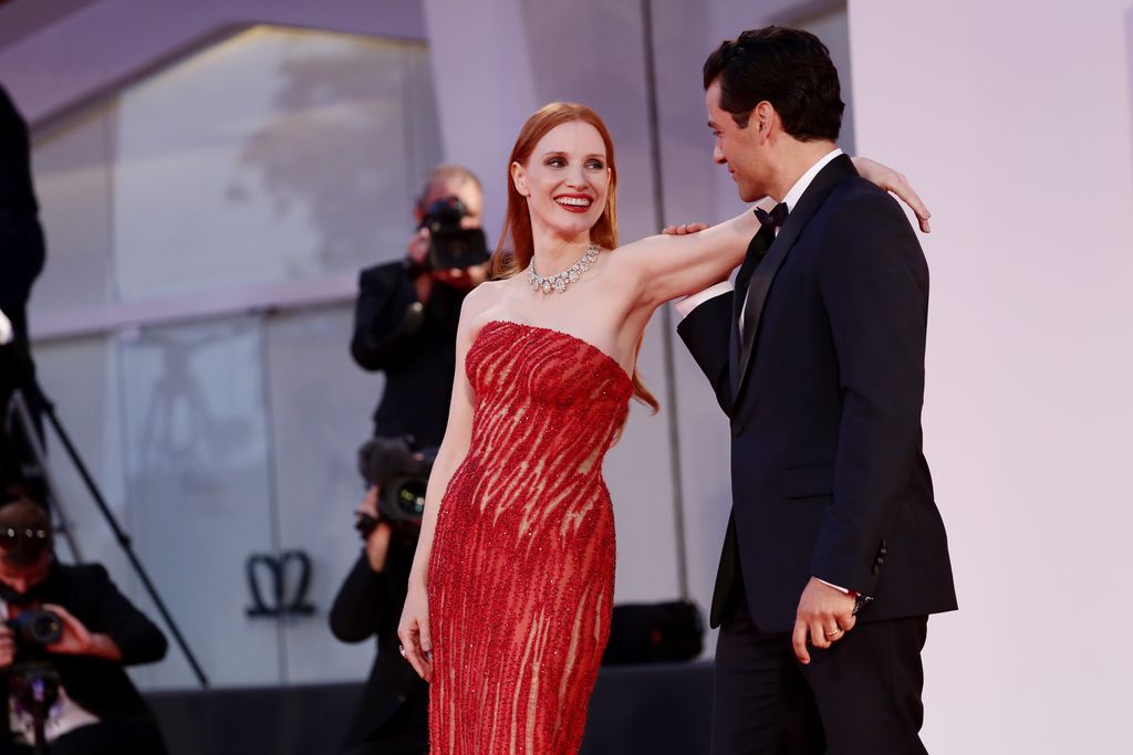 VENICE, ITALY - SEPTEMBER 04: Jessica Chastain and Oscar Isaac attend the red carpet of the movie 