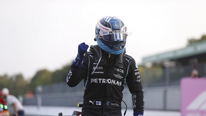 Mercedes driver Valtteri Bottas of Finland reacts after he clocked the fastest time during the qualifying session at the Monza racetrack, in Monza, Italy , Friday, Sept.10, 2021. The Formula one race will be held on Sunday. (Lars Baron/Pool photo via AP)