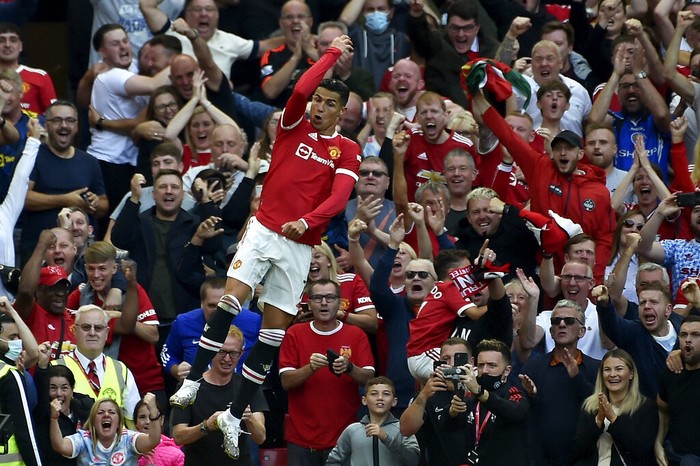 Manchester Uniteds Cristiano Ronaldo celebrates after scoring his sides second goal during the English Premier League soccer match between Manchester United and Newcastle United at Old Trafford stadium in Manchester, England, Saturday, Sept. 11, 2021. (AP Photo/Rui Vieira)