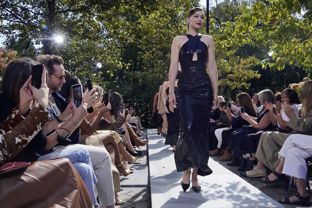 The Michael Kors Spring/Summer 2022 collection is modeled during Fashion Week in New York, Friday, Sept. 10, 2021. (AP Photo/Richard Drew)