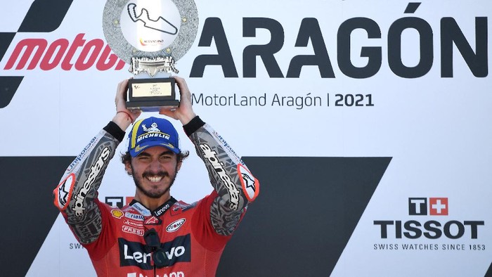 Ducati Italian rider Francesco Bagnaia celebrates on the podium after winning the Moto Grand Prix of Aragon at the Motorland circuit in Alcaniz on September 12, 2021. (Photo by LLUIS GENE / AFP)