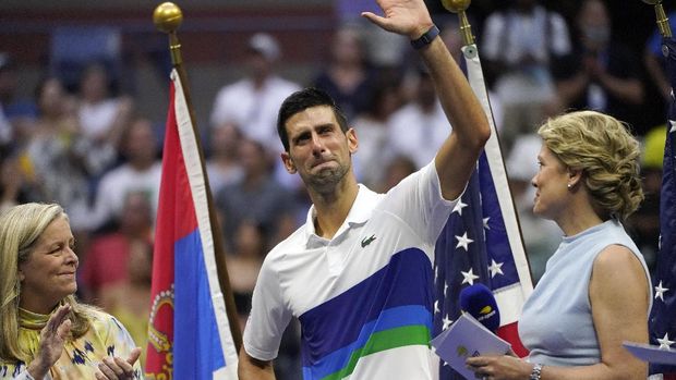Novak Djokovic, of Serbia, center, waves to the crowd after losing to Daniil Medvedev, of Russia, in the men's singles final of the US Open tennis championships, Sunday, Sept. 12, 2021, in New York. (AP Photo/Elise Amendola)
