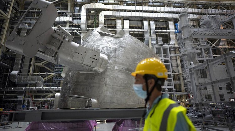 A part of the cryostat component of the ITER machine is pictured in Saint-Paul-Lez-Durance, France, Thursday, Sept. 9, 2021. Scientists at the International Thermonuclear Experimental Reactor in southern France took delivery of the first part of a massive magnet so strong its American manufacturer claims it can lift an aircraft carrier. (AP Photo/Daniel Cole)