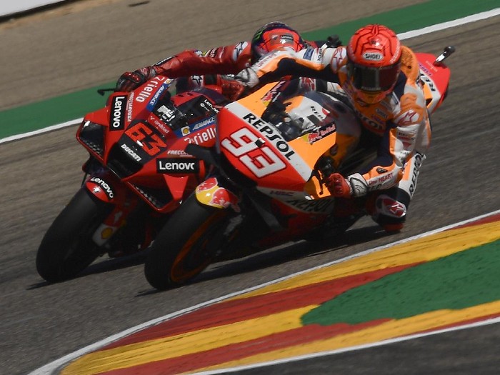 Marc Marquez of Spain, (93), briefly leads Francesco Bagnaia of Italy during the Alcaniz Aragon Moto GP race at the MotorLand Aragon circuit, in Alcaniz, Spain Sunday, Sept. 12, 2021. Bagnaia won the race from Marquez by almost 7 tenths of a second. (AP Photo/Jose Breton)