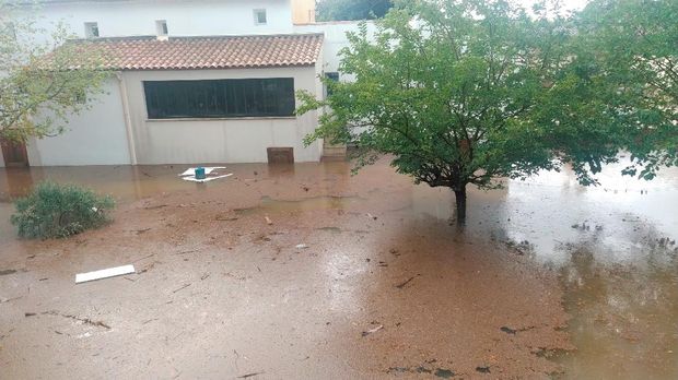 A tree stands amongst flood waters in Aigues-Vives, Gard, France September 14, 2021, in this screen grab obtained from a social media video. @STAWIXBLINK/via REUTERS THIS IMAGE HAS BEEN SUPPLIED BY A THIRD PARTY. MANDATORY CREDIT. NO RESALES. NO ARCHIVES.