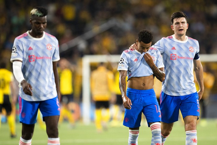 From left, Manchester Uniteds Paul Pogba, Jesse Lingard and Harry Maguire leave the pitch after of the Champions League group F soccer match between BSC Young Boys and Manchester United, at the Wankdorf stadium in Bern, Switzerland, Tuesday, Sept. 14, 2021. (Peter Klaunzer/Keystone via AP)