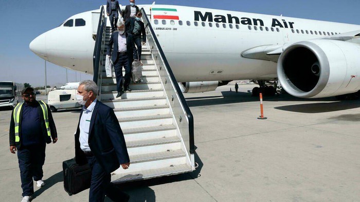 Passengers get off a Mahan Air flight at the airport in Kabul on September 15 (Karim SAHIB/AFP)