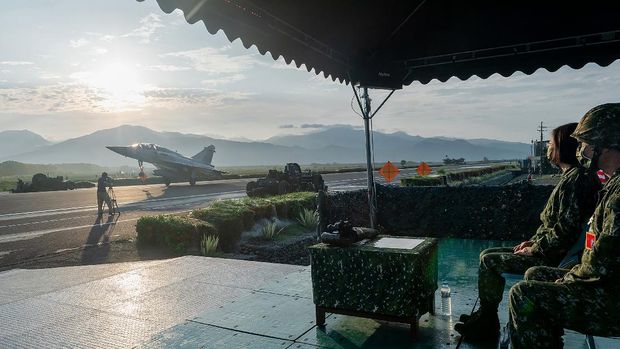 In this photo released by the Taiwan Presidential Office, a military jet taxis along a highway in Jiadong, Taiwan, Wednesday, Sept. 15, 2021. Four military aircraft landed on the highway and took off again on Wednesday as part of Taiwan's five-day Han Guang military exercise designed to prepare the island's forces for an attack by China, which claims Taiwan as part of its own territory. (Taiwan Presidential Office via AP)