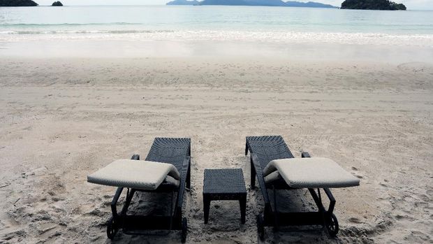 Empty chairs are seen at The Datai Langkawi resort beach, as Langkawi gets ready to open to domestic tourists from September 16, amid the coronavirus disease (COVID-19) outbreak, Malaysia September 14, 2021. REUTERS/Lim Huey Teng