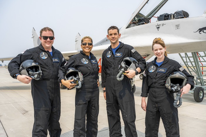 In this Aug. 8, 2021 photo provided by John Kraus, from left, Chris Sembroski, Sian Proctor, Jared Isaacman and Hayley Arceneaux stand for a photo in Bozeman, Mont., during a fighter jet training weekend to familiarize the crew with G-forces. (John Kraus/Inspiration4 via AP)
