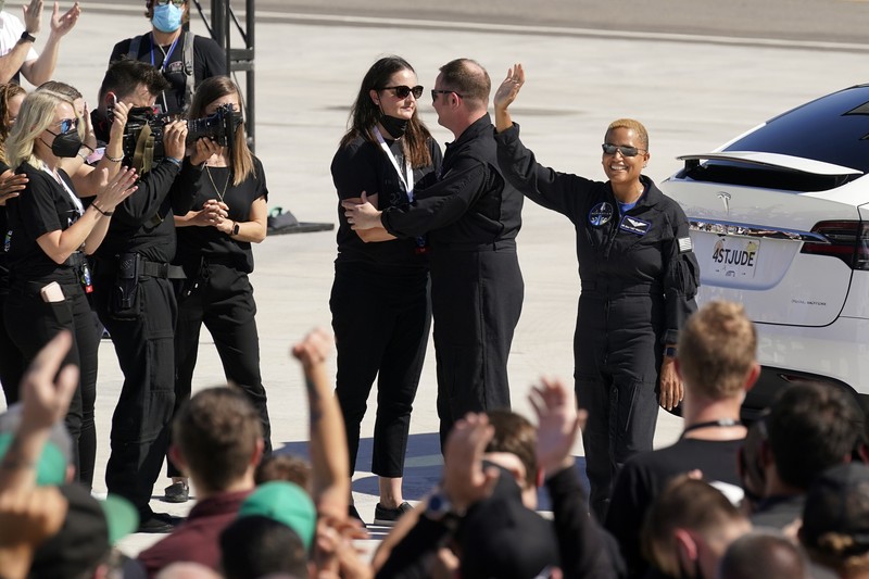 In this Aug. 8, 2021 photo provided by John Kraus, from left, Chris Sembroski, Sian Proctor, Jared Isaacman and Hayley Arceneaux stand for a photo in Bozeman, Mont., during a 