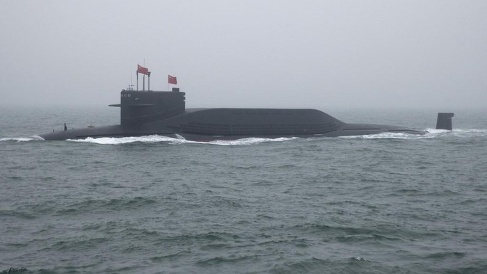 A type 094 Jin-class nuclear submarine Long March 15 of the Chinese Peoples Liberation Army (PLA) Navy participates in a naval parade to commemorate the 70th anniversary of the founding of Chinas PLA Navy in the sea near Qingdao, in eastern Chinas Shandong province on April 23, 2019. - China celebrated the 70th anniversary of its navy by showing off its growing fleet in a sea parade featuring a brand new guided-missile destroyer. (Photo by Mark Schiefelbein / POOL / AFP)