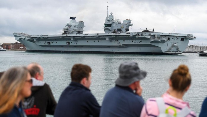 PORTSMOUTH, ENGLAND - JUNE 06: Aircraft Carrier Prince of Wales departs from the dock on June 06, 2021 in Portsmouth, England. The warship's departure was postponed from its originally scheduled disembarkation yesterday afternoon. (Photo by Finnbarr Webster/Getty Images)